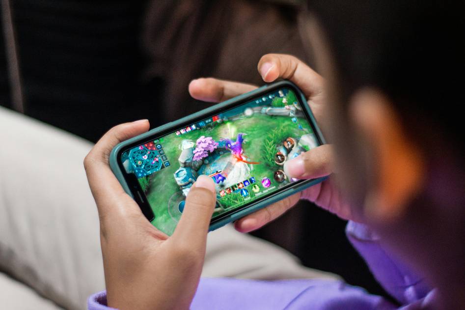 Blog author exploring adult mobile game content on tablet